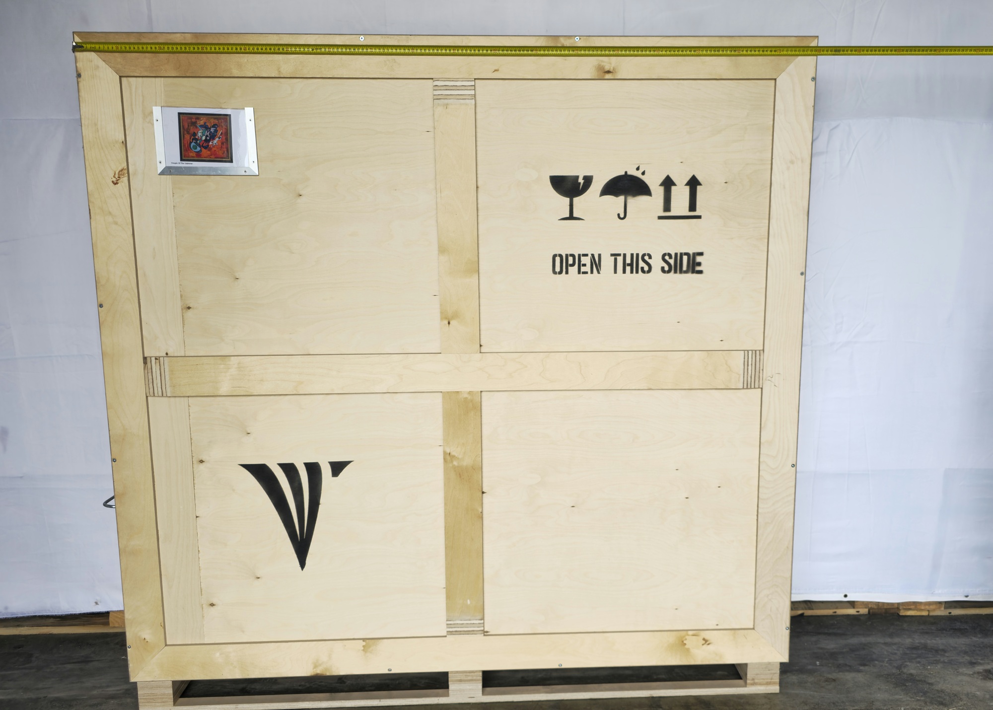 Crate width reference for The couple of the universe, 2006 with tape measure